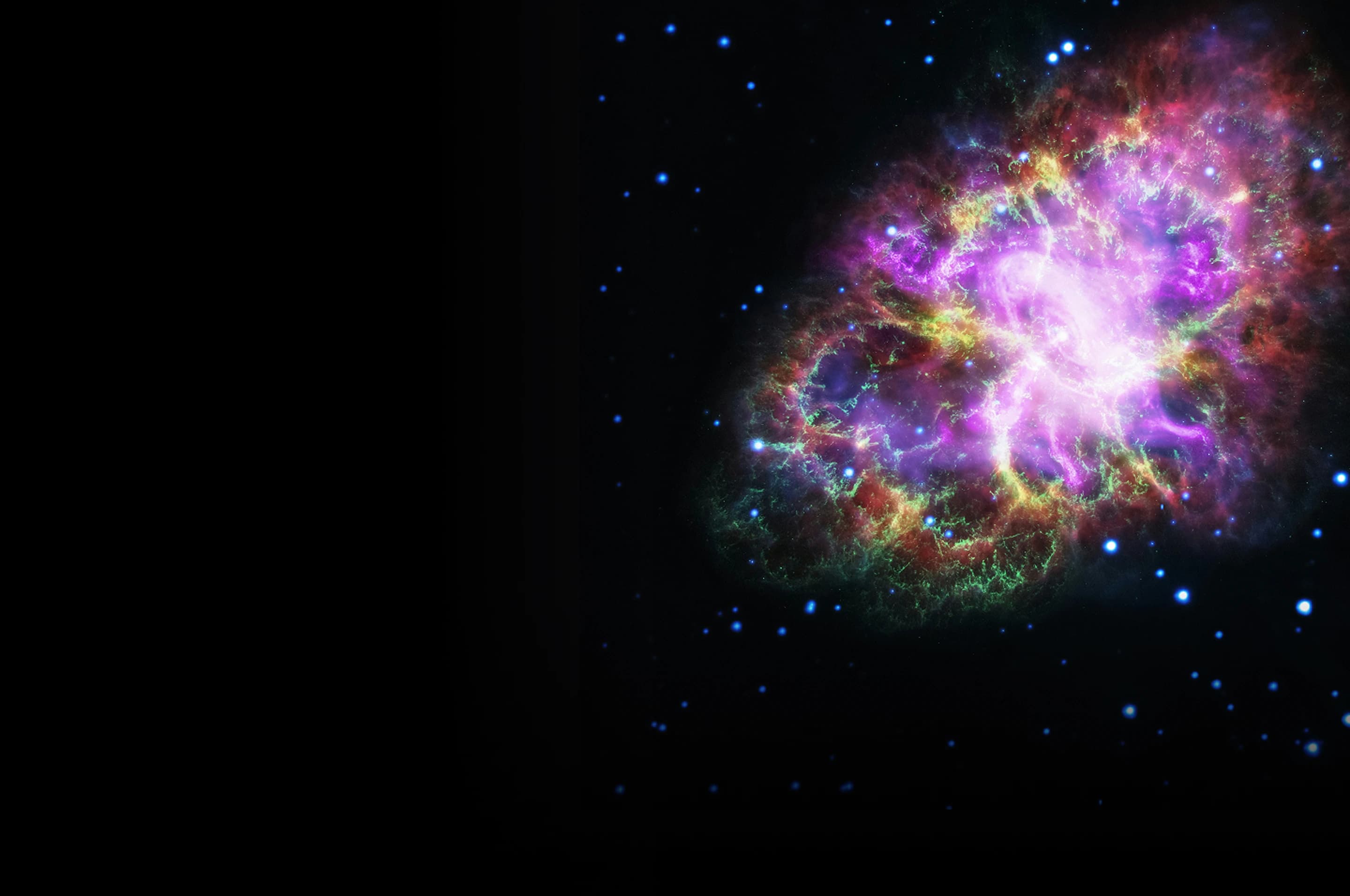 A vibrant, colorful nebula in deep space, glowing with shades of purple, pink, green, and gold against a dark star-filled background.
